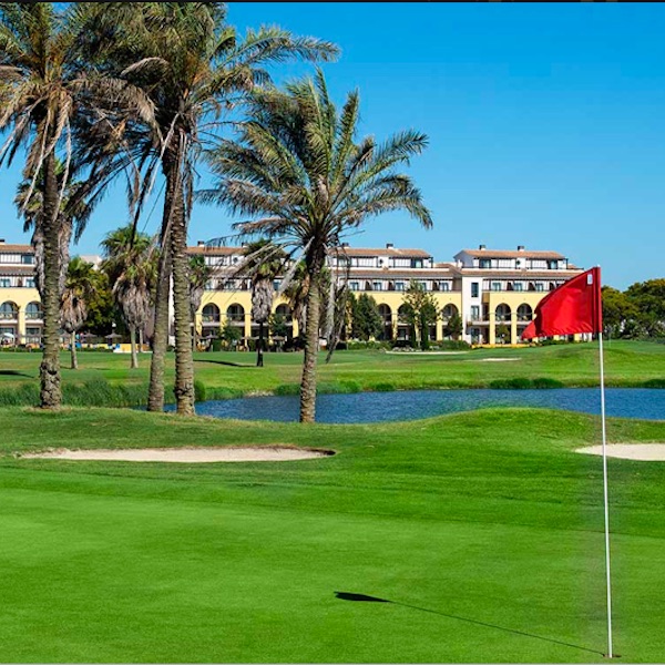 View of flag on the green and Barcelo Costa Ballena