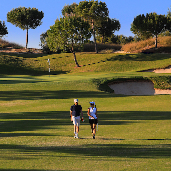 Golfers walk down the 12th fairway on Las Colinas Golf, Costa Blanca