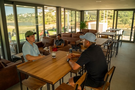 Enjoying a beer after the round at The Alto Club