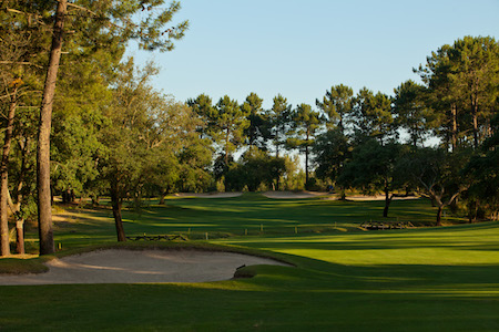 Hazards guarding this green include a creek in front and side bunker