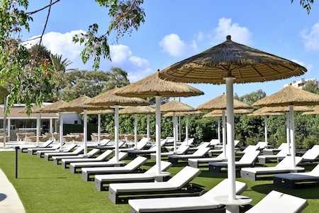 Pool chairs and umbrellas at Salles Marina Portals